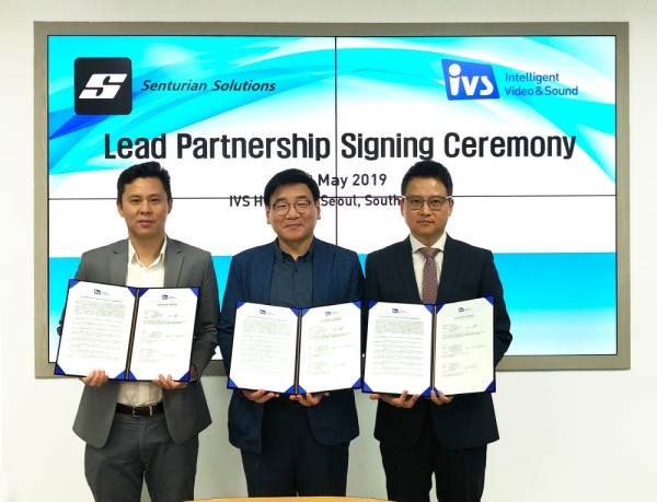 IVS CEO Bae Young-hoon (center) poses for the camera with Sean Tham (left), global sales director of Senturian, and Choi Kyung-jin, head of IVS Singapore Corp., after signing a partnership pact on May 15.